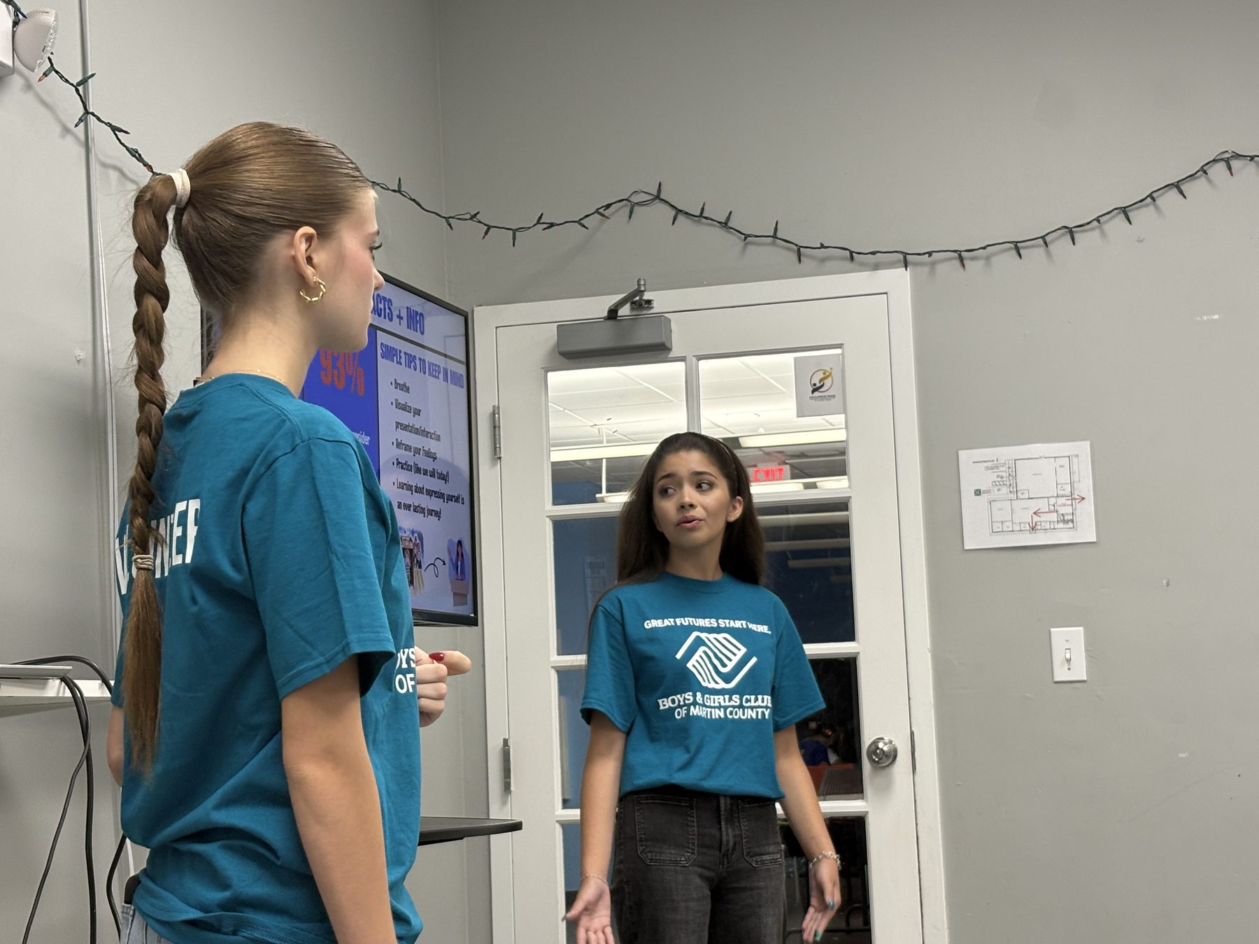 Two Speak2Achieve volunteers demonstrating a speaking exercise during a workshop